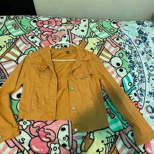 A brown and yellow ish colored jacket